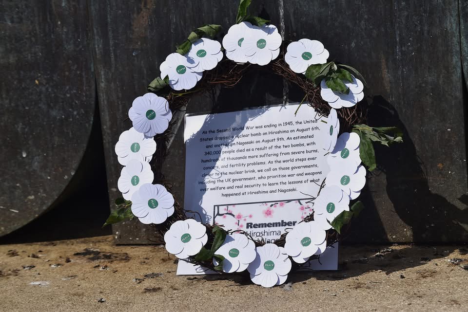 A wreath of white poppies was laid at the Breath sculpture